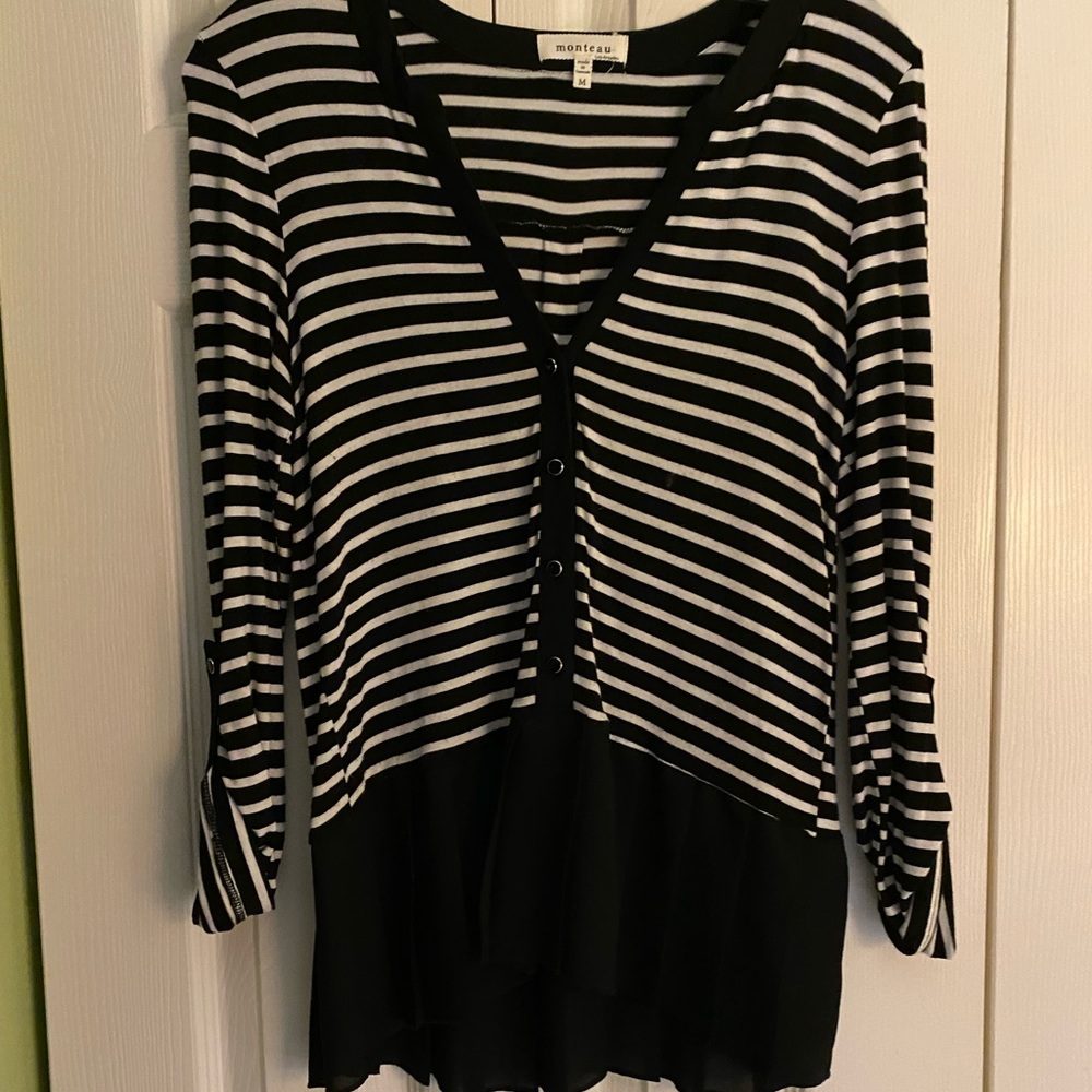 Large black and white strip shirt.